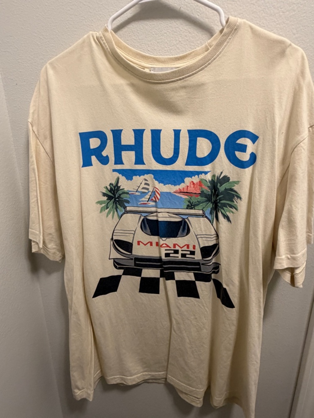 Rhude Cream Tee with Blue Logo and Multicolor Graphic